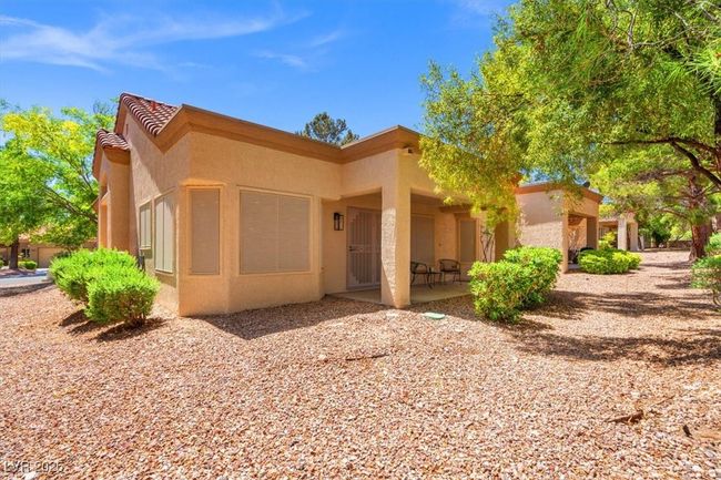 Relax & unwind in the serene covered patio in the backyard. | Image 32