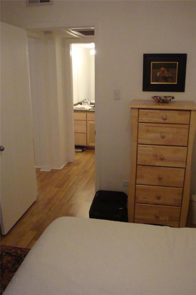 Bedroom featuring light wood-style flooring and a sink | Image 6