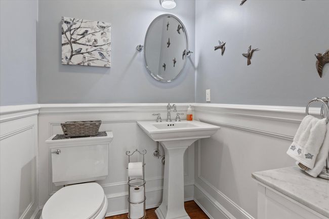 Half bath featuring a wainscoted wall and toilet | Image 8