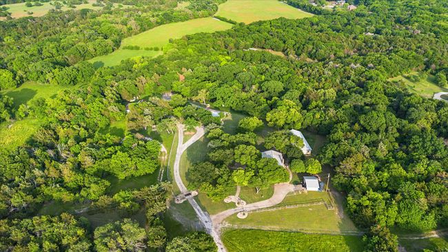 Bird's eye view featuring a forest view | Image 7