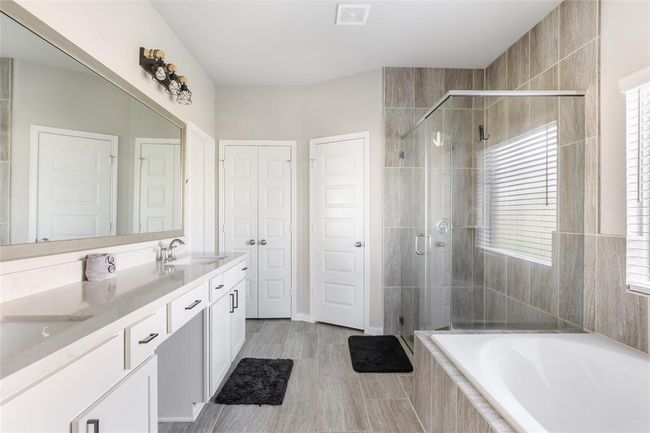 Primary bath has a spa like feel. | Image 21