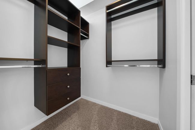 Walk in closet with carpet flooring | Image 31