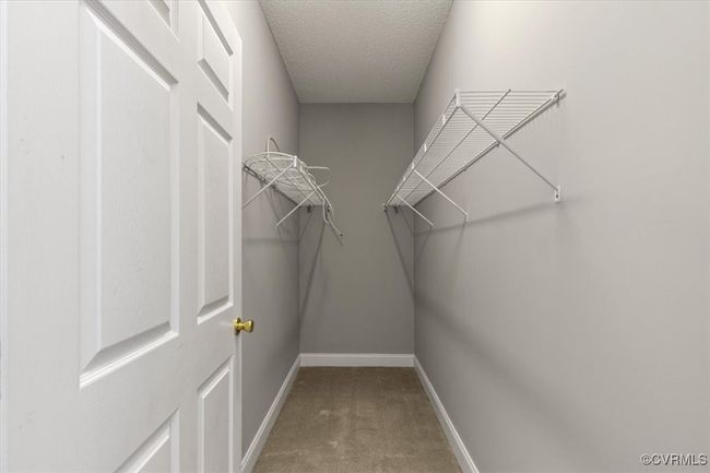 Spacious closet featuring carpet floors | Image 29