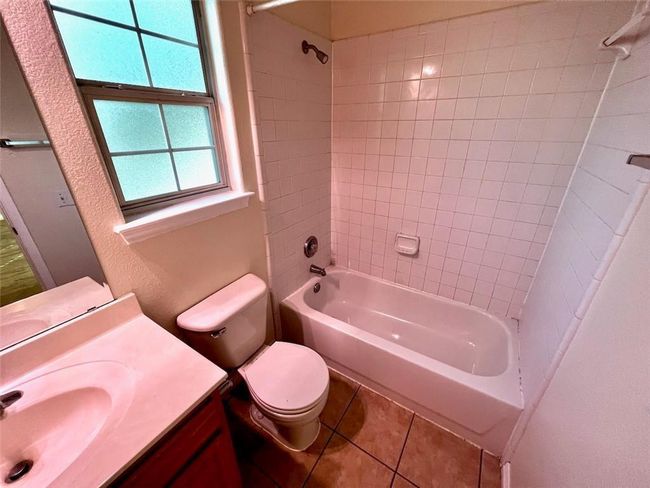 Bathroom with vanity, shower combination, and tile patterned flooring | Image 9
