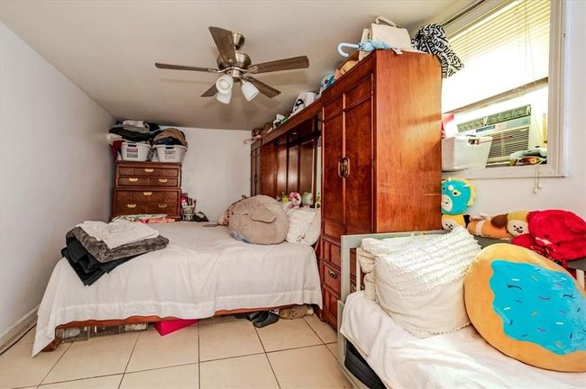 Tiled bedroom with ceiling fan | Image 14
