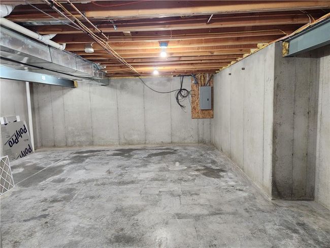 Unfinished below grade area featuring electric panel | Image 15