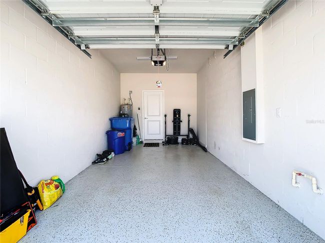 Attached garage with epoxy floor. | Image 33