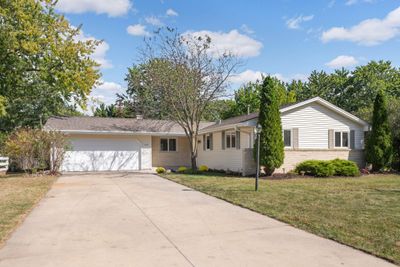 Welcome home to this charming 1 level home perfectly located on a spacious flat lot. You'll love the quality of this home with Anderson windows, new carpet & fresh paint. | Image 1