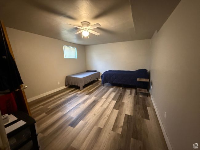 Bedroom featuring baseboards, wood finished floors, and a ceiling fan | Image 12