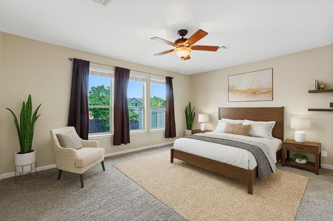 Bedroom featuring light carpet and ceiling fan | Image 17