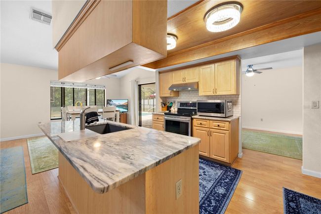 7660 Holiday Dr, House other with 4 bedrooms, 3 bathrooms and null parking in Spring Hill FL | Image 28