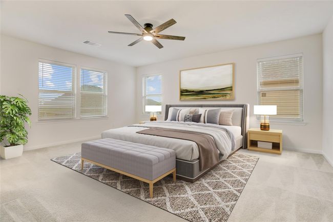The primary suite is spacious and bright, with room for all your furniture needs. | Image 14