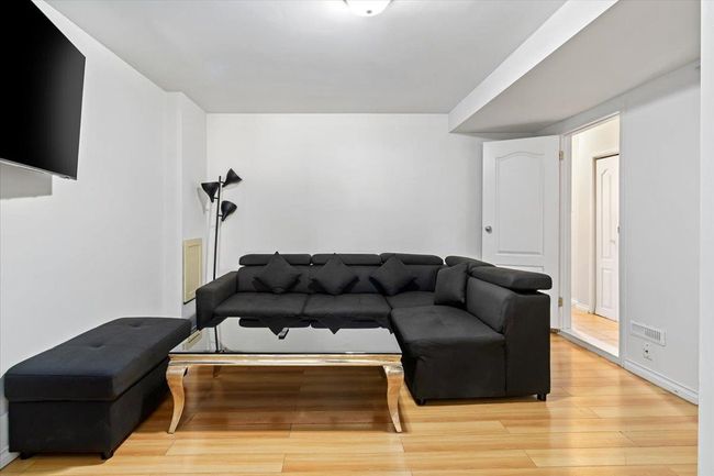 Living room featuring light wood-style floors | Image 23