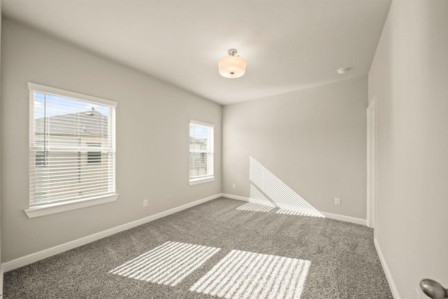 Another sunlit secondary bedroom with easy access to the upstairs living areas. | Image 26