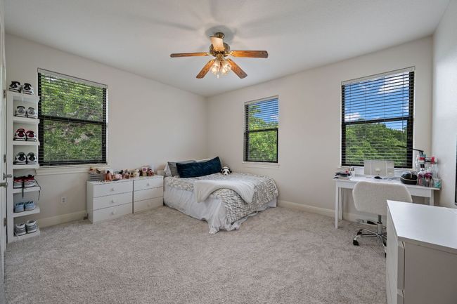 Carpeted bedroom featuring baseboards and ceiling fan | Image 27