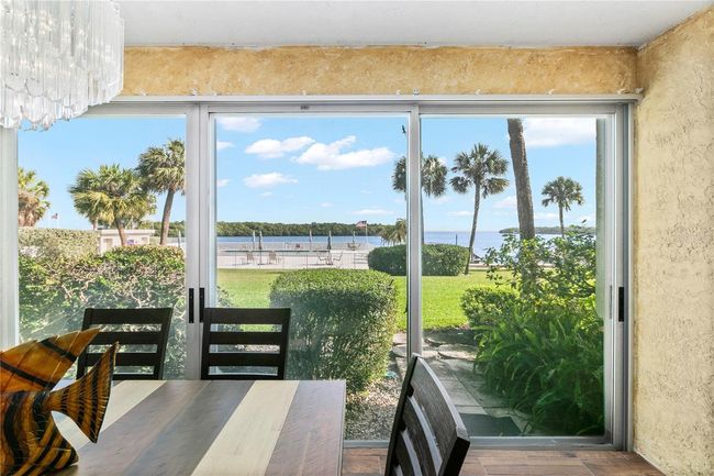 Dining Room looking out to Pool and Bay | Image 13