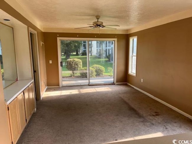 Empty room featuring carpet and ceiling fan | Image 4