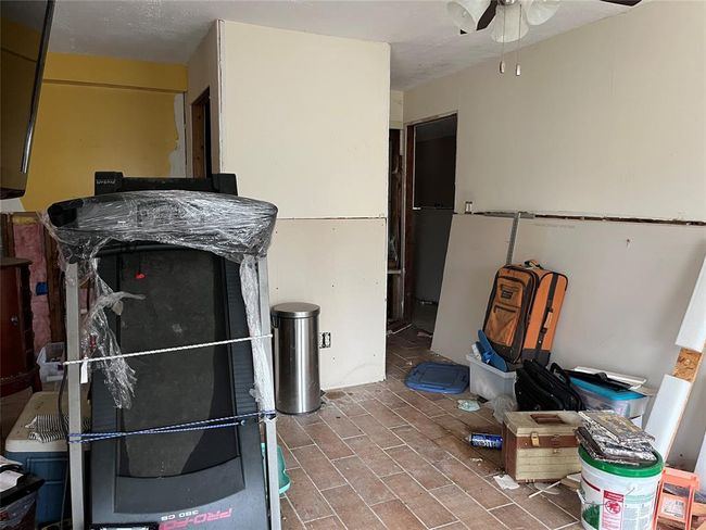 Downstairs. You can see some sheetrock was replaced and there are tile floors. | Image 20