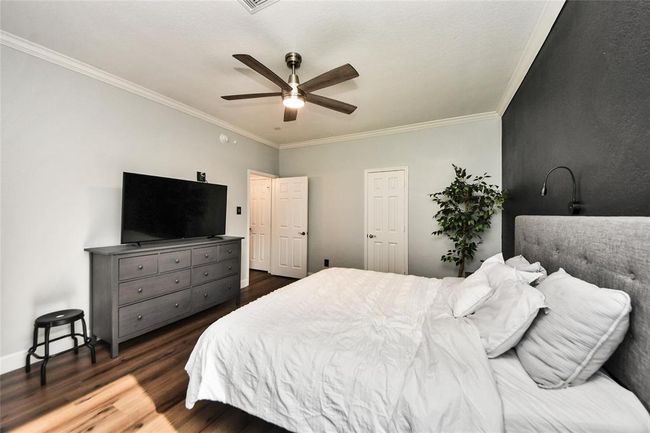 No carpet and a ceiling fan for added comfort. | Image 16
