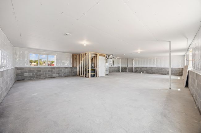 The unfinished lower level awaits your finishing touches! | Image 21