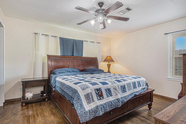 Primary Bedroom is located at the end of the hall, and offers an updated ensuite bath | Image 16