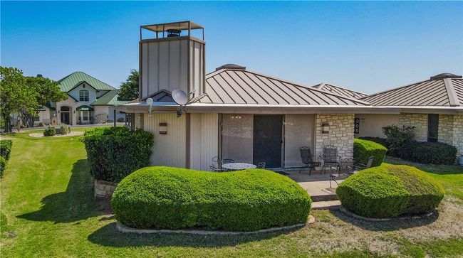 Back patio overlooking courtyard and pool | Image 16