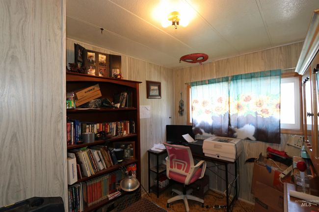 Office space featuring a textured ceiling | Image 19