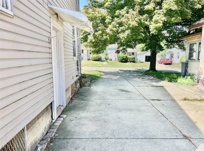 VIEW FROM THE TWO CAR GARAGE, DOWN THE SHARED DRIVEWAY. | Image 3