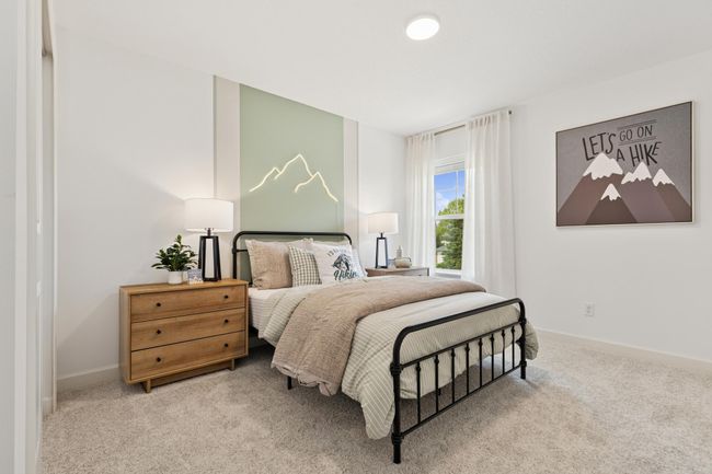 (Photo of decorated model, actual home's finishes will vary) Each of the home's secondary bedrooms come perfectly sized and all feature a spacious closet. | Image 14