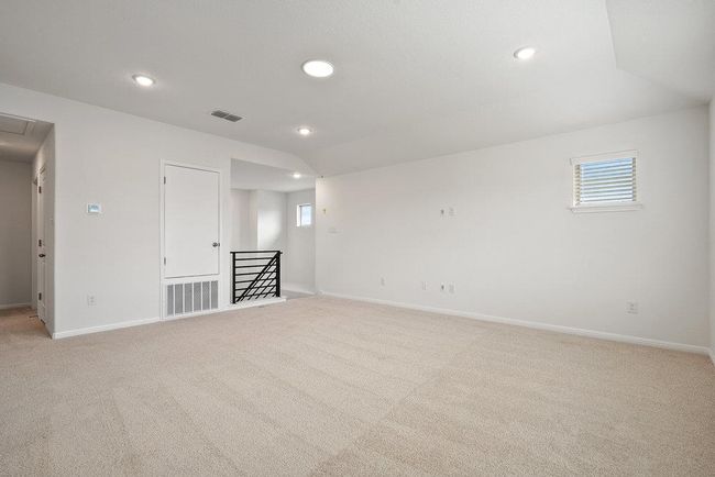 Unfurnished room featuring light carpet, recessed lighting, attic access, and plenty of natural light | Image 14