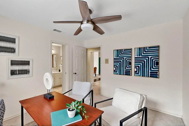Office space featuring a ceiling fan and light carpet | Image 34