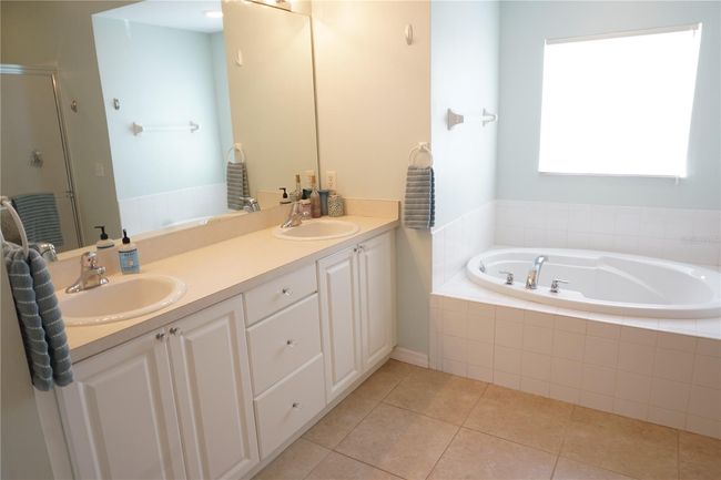 Primary ensuite has dual sinks, garden tub, walk-in shower | Image 22