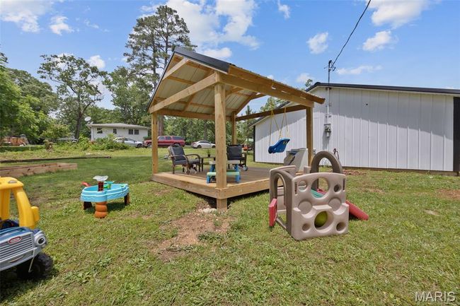 View of grassy yard featuring a deck | Image 21
