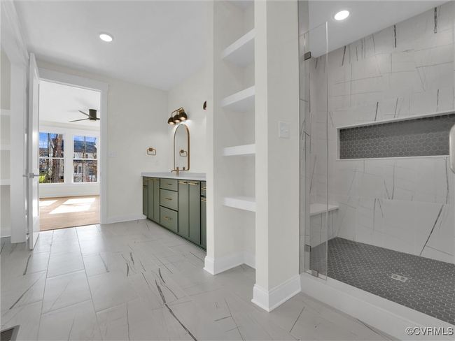 Photo represents the plan, not the actual home. Design selections may vary. The primary suite with walk-in closet and ensuite bath with walk-in shower and double vanity. | Image 14