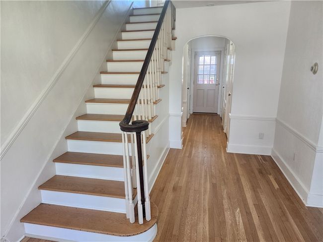 Entry is 14' deep and has two closets and a powder room. | Image 7
