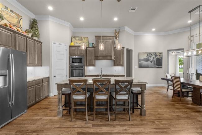 Kitchen featuring decorative lighting and Alderwood cabinets | Image 14