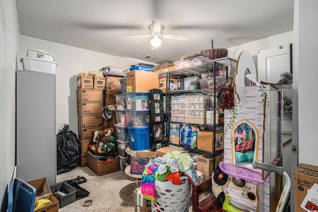 Storage area with ceiling fan | Image 25