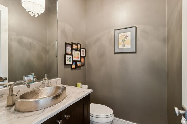 Bathroom with vanity and a chandelier | Image 22
