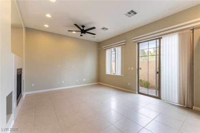 Unfurnished living room with baseboards, visible vents, ceiling fan, and recessed lighting | Image 13