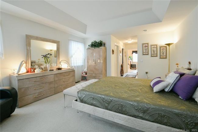 Lovely space with a tray ceiling and plenty of natural light. | Image 23
