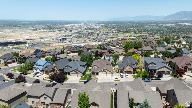 Aerial view of property and surrounding area featuring a mountainous background and nearby suburban area | Image 31