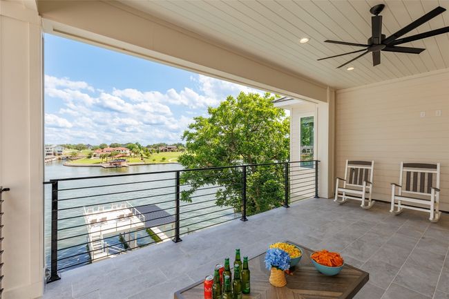 Upper Balcony featuring a water view and ceiling fan. | Image 30