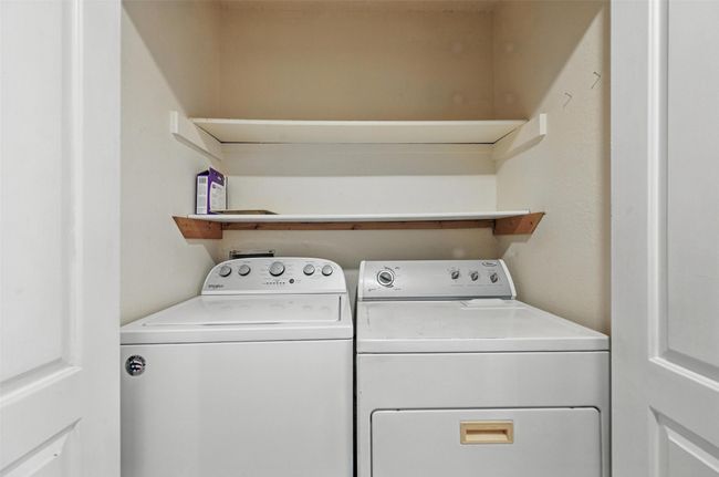 Washroom featuring washing machine and clothes dryer which convey with property | Image 12