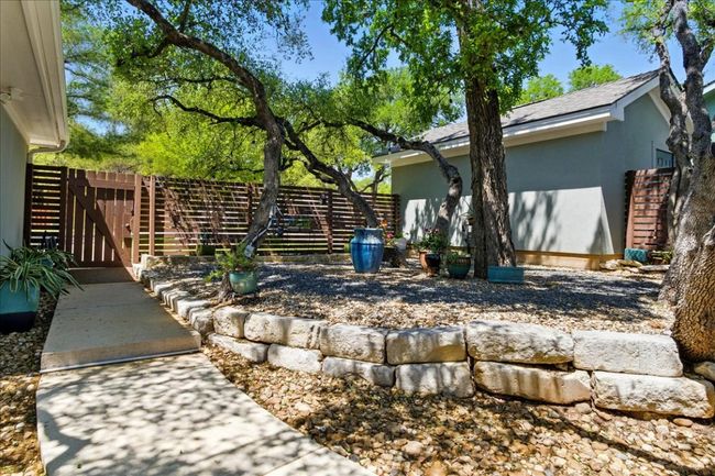 View of yard with fence and a gate | Image 36