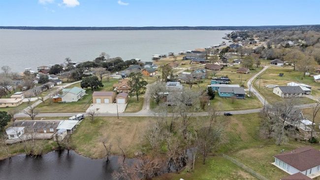 Aerial photo shows a lakeside community. The neighborhood is nestled near Lake Livingston, offering scenic views and a relaxed atmosphere ideal for a tranquil lifestyle. | Image 40