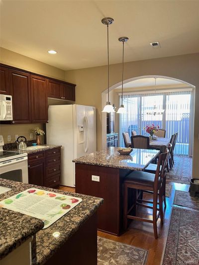 Kitchen with Island and open to dining room | Image 1