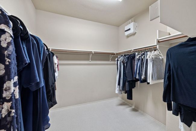 Walk in closet featuring carpet flooring | Image 18
