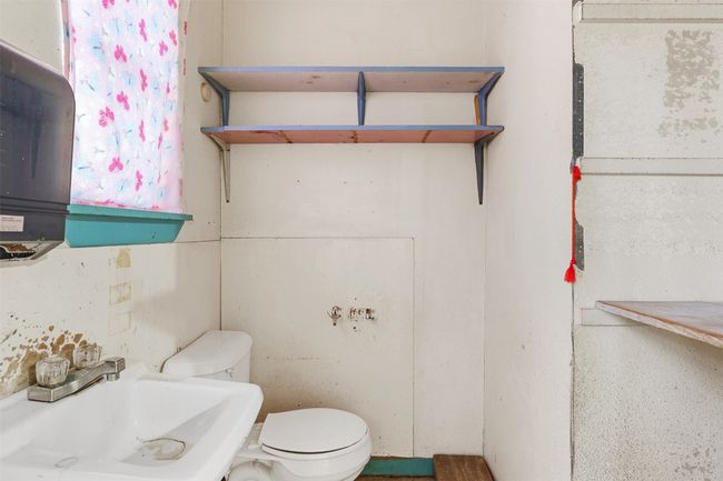 Half bath featuring toilet and a sink | Image 15