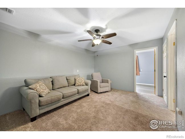 Large carpeted flex-space--perfect for a great room, home gym, craft room, playroom, theater...the possibilities are endless! | Image 21