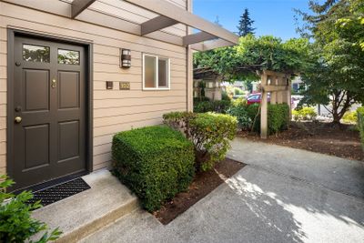 #102 enjoys end-unit location with south/west/northern exposure. Entrance to the home shown here. | Image 2